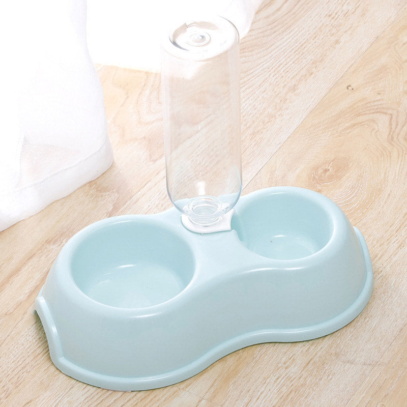 Pet bowl with drinking bottle.