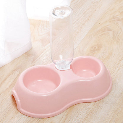 Pet bowl with drinking bottle.