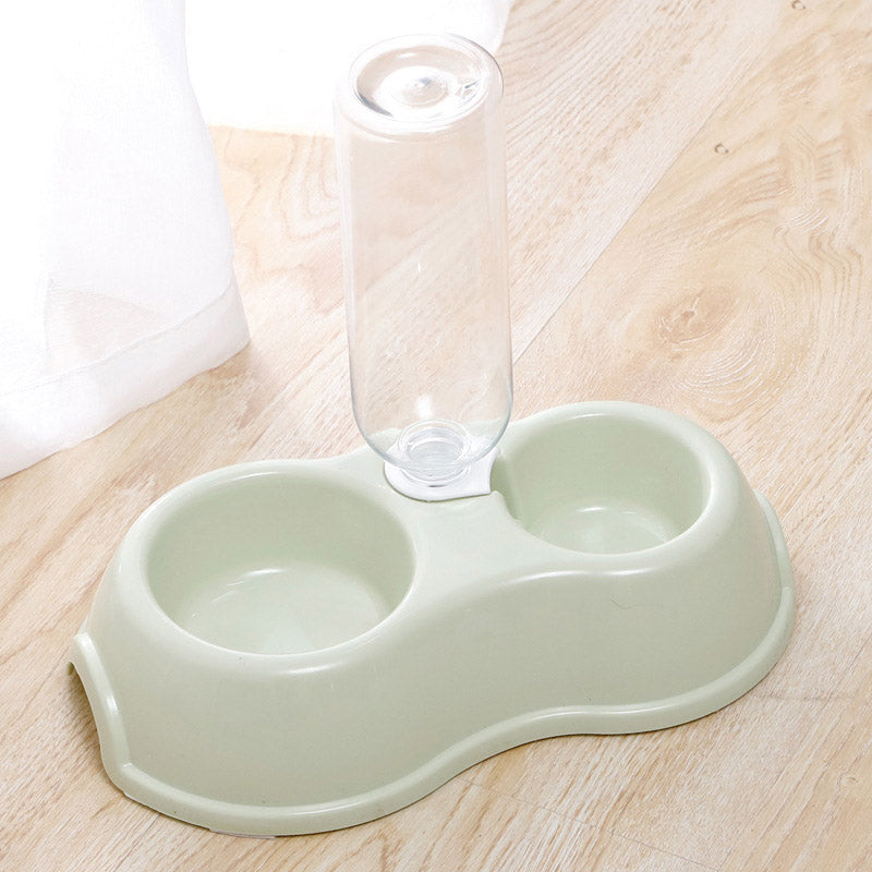 Pet bowl with drinking bottle.